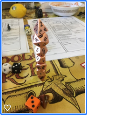 A stack of various kinds of Dungeons and Dragons Dice on a map