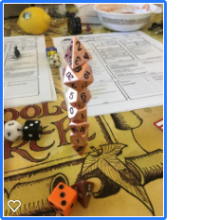 A stack of various kinds of Dungeons and Dragons Dice on a map